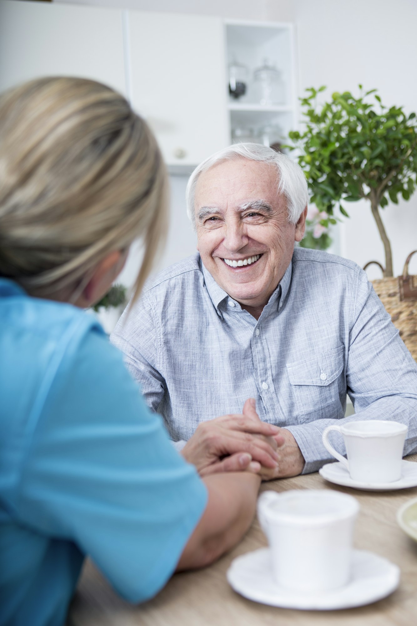 Gereatric nurse listening to elderly patient